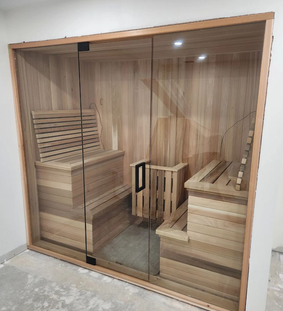Floor-to-ceiling glass front on a custom cedar sauna in Kitchener